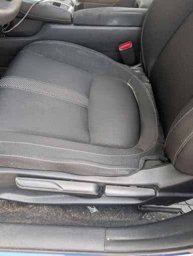 Driver seat before Dash Hero interior cleaning